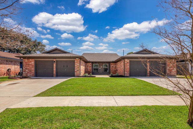 view of front facade featuring a front lawn, an attached garage, brick siding, and driveway