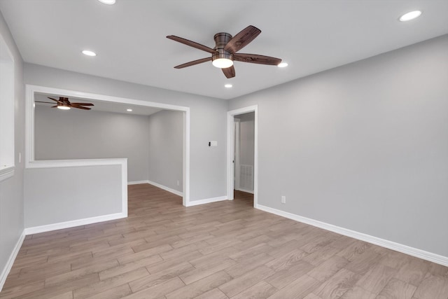 spare room with recessed lighting, baseboards, wood finished floors, and ceiling fan