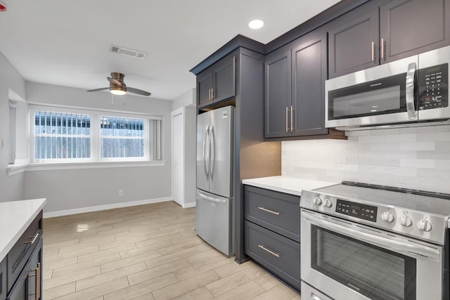 kitchen with visible vents, backsplash, ceiling fan, light countertops, and appliances with stainless steel finishes