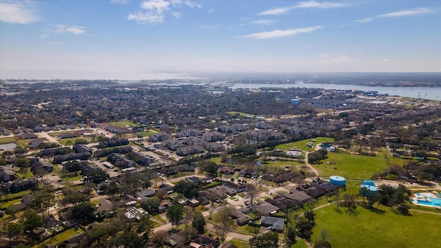 birds eye view of property featuring a water view and a residential view