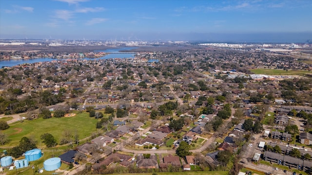 birds eye view of property with a residential view and a water view