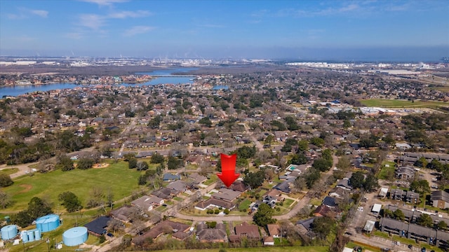 bird's eye view with a residential view and a water view