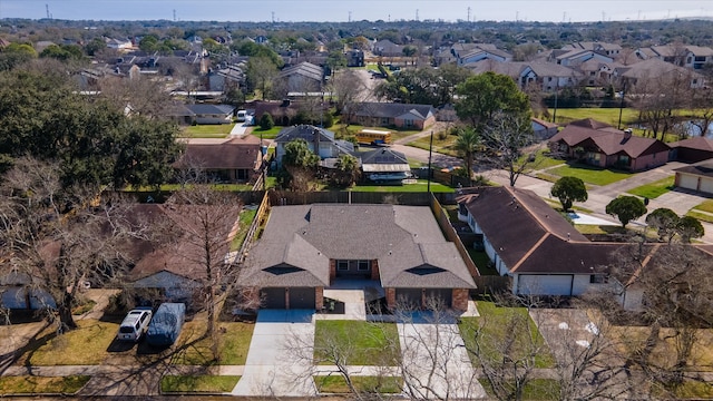 birds eye view of property with a residential view