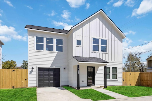 modern inspired farmhouse featuring a gate, board and batten siding, a garage, and fence