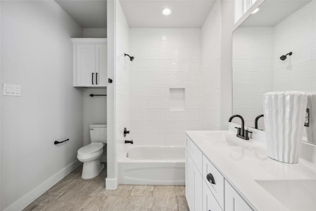 4715 Ward St, Houston, TX 77021 - bathroom featuring toilet, double vanity, washtub / shower combination, baseboards, and recessed lighting