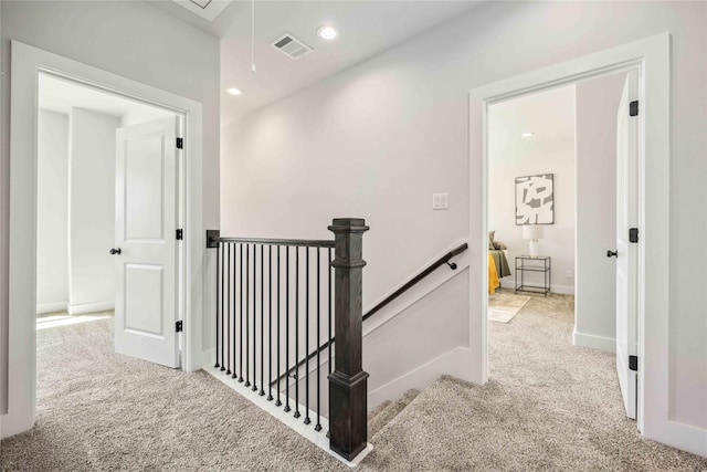 4715 Ward St, Houston, TX 77021 - hallway with an upstairs landing, carpet flooring, attic access, recessed lighting, and baseboards