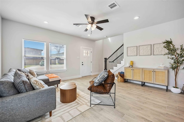 4715 Ward St, Houston, TX 77021 - living room featuring light wood-style flooring, stairs, a ceiling fan, recessed lighting, and baseboards