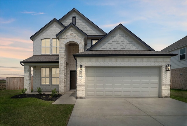 352 Spruce Oak Ln, Waller, TX 77484 - view of front of property with driveway, an attached garage, roof with shingles, stone siding, and brick siding