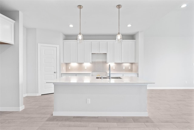 352 Spruce Oak Ln, Waller, TX 77484 - kitchen featuring a sink, light wood-style flooring, white cabinets, backsplash, and recessed lighting