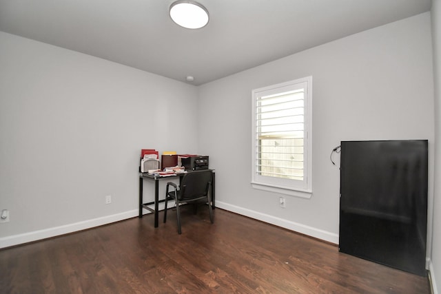 office space featuring wood finished floors and baseboards