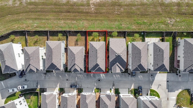 birds eye view of property with a residential view