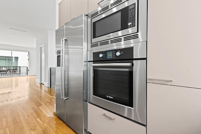 kitchen with stainless steel appliances and light wood-type flooring