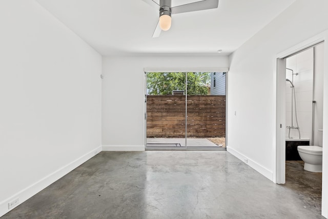 unfurnished bedroom with baseboards, finished concrete floors, and ensuite bathroom