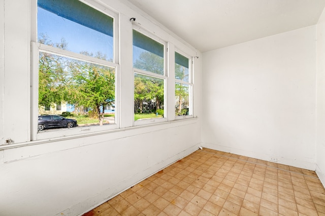 spare room featuring light floors