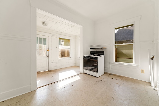 interior space featuring gas range gas stove and light floors