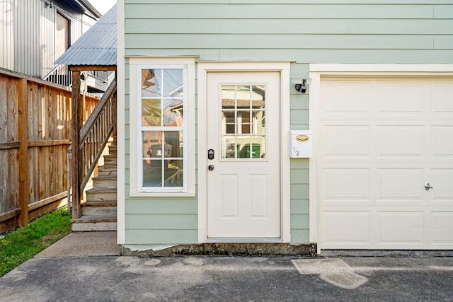 view of exterior entry with fence
