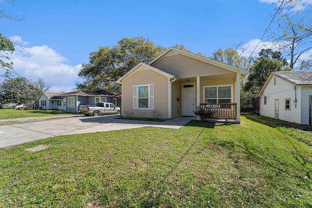 1013 Veronica St, La Marque, TX 77568 - bungalow-style house featuring a porch, a front lawn, and concrete driveway