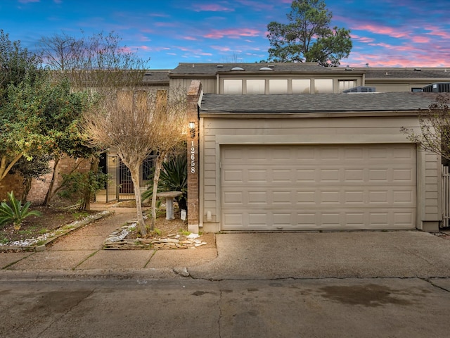 garage featuring driveway