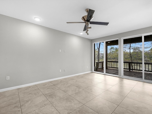 tiled spare room with recessed lighting, baseboards, and ceiling fan