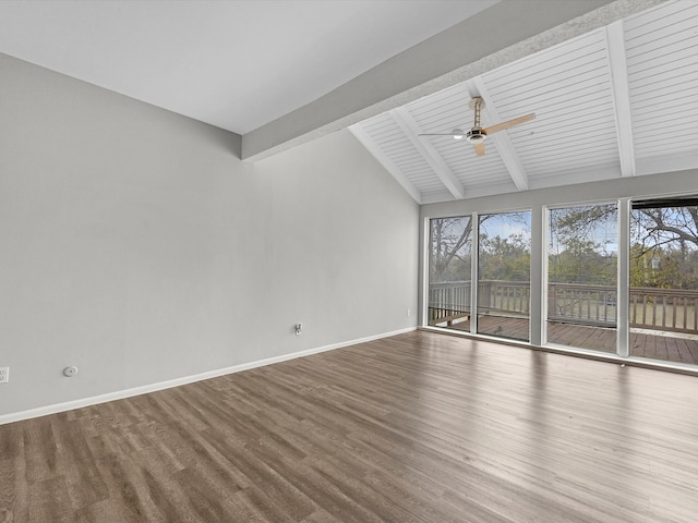 spare room featuring ceiling fan, lofted ceiling with beams, baseboards, and wood finished floors