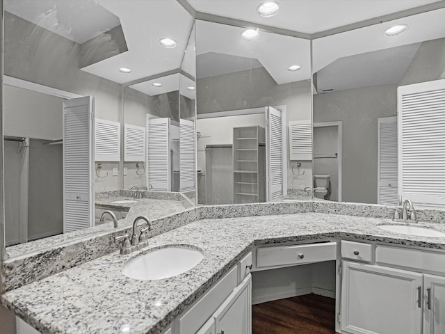 full bath featuring recessed lighting, toilet, wood finished floors, and vanity