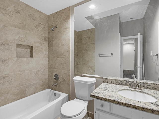 bathroom with bathtub / shower combination, toilet, vanity, and visible vents