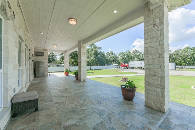 view of patio / terrace featuring fence