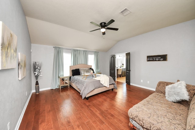 bedroom featuring visible vents, wood finished floors, baseboards, lofted ceiling, and ceiling fan