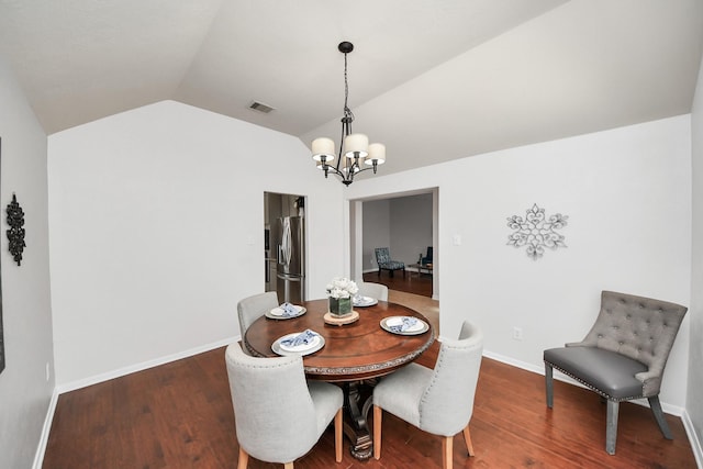 dining area with wood finished floors, baseboards, visible vents, lofted ceiling, and a chandelier