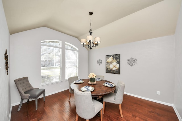 dining room featuring baseboards, lofted ceiling, a notable chandelier, and wood finished floors