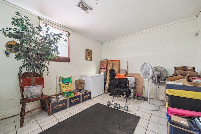 interior space with tile patterned flooring and visible vents