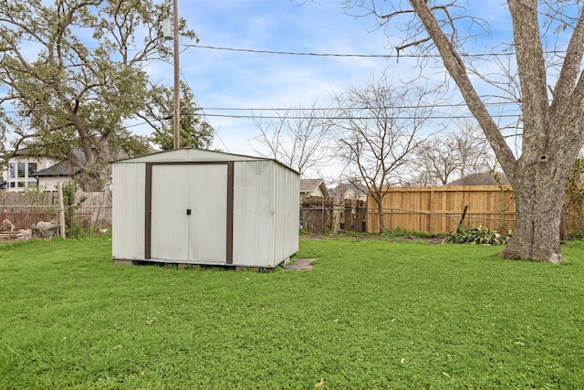 view of shed featuring a fenced backyard