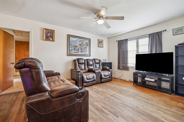 living room featuring wood finished floors and a ceiling fan