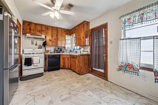 kitchen with visible vents, white range with gas cooktop, under cabinet range hood, freestanding refrigerator, and dishwasher