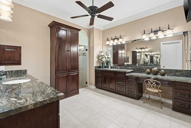 bathroom featuring tile patterned floors, vanity, ceiling fan, and crown molding