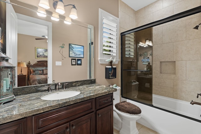 full bath featuring connected bathroom, ceiling fan, toilet, shower / bath combination with glass door, and vanity