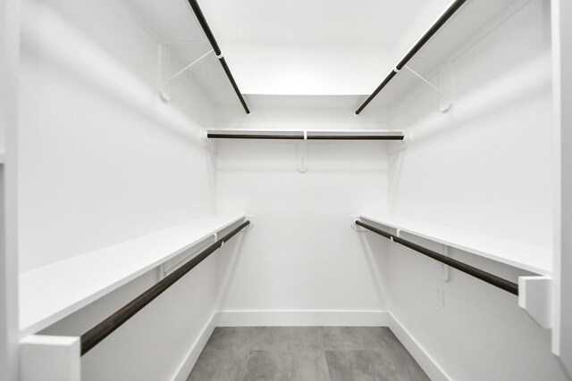 spacious closet with light wood-style flooring