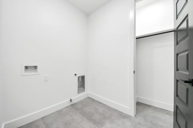 laundry area with electric dryer hookup, hookup for a washing machine, baseboards, and laundry area