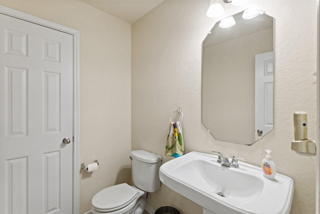 bathroom featuring a sink and toilet