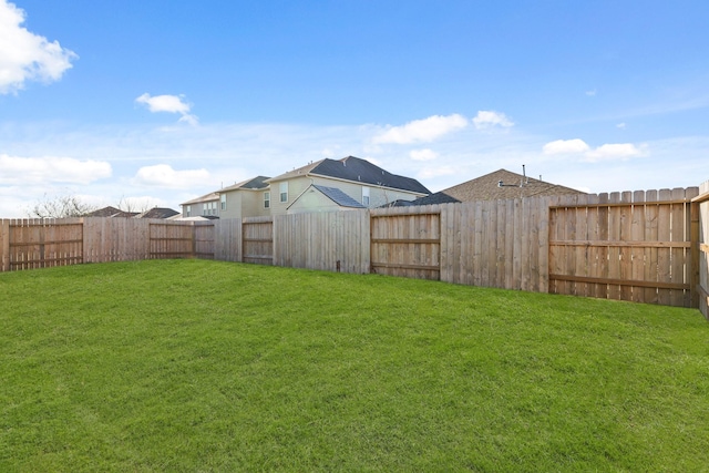 view of yard featuring a fenced backyard