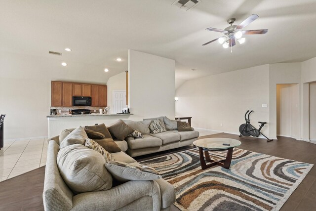 living room featuring recessed lighting, visible vents, wood finished floors, and ceiling fan