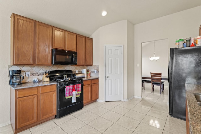 kitchen featuring decorative backsplash, black appliances, brown cabinets, and an inviting chandelier