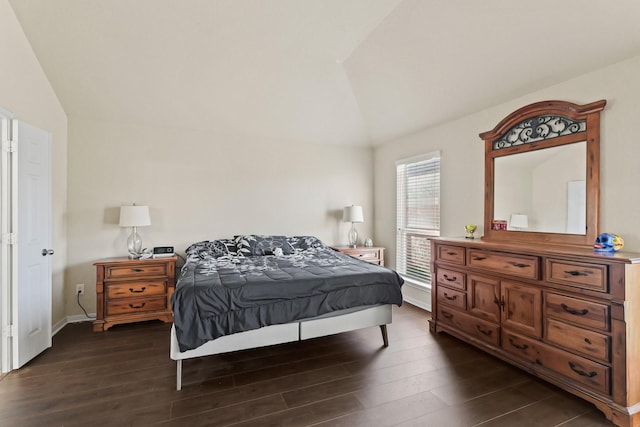 bedroom featuring vaulted ceiling, baseboards, and dark wood-style flooring