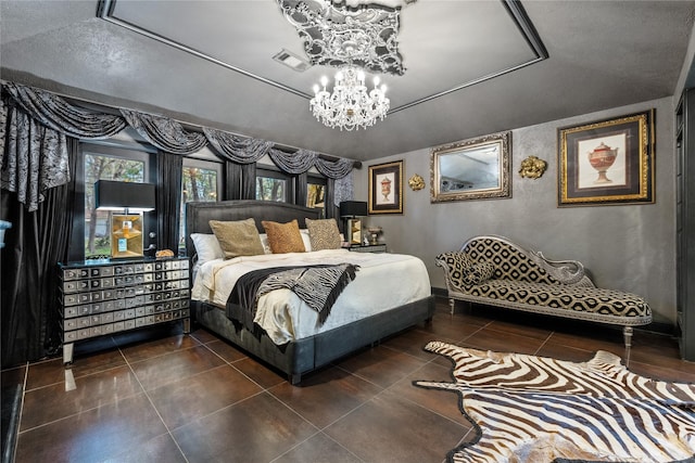 bedroom with tile patterned floors, a notable chandelier, visible vents, and baseboards