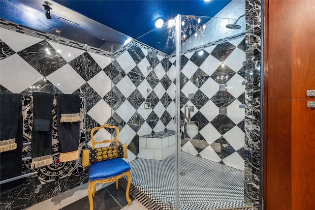 bathroom with a tile shower