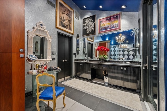 bathroom featuring visible vents, lofted ceiling, decorative backsplash, tile patterned floors, and vanity