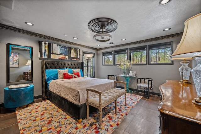 bedroom with recessed lighting, visible vents, baseboards, and a textured ceiling