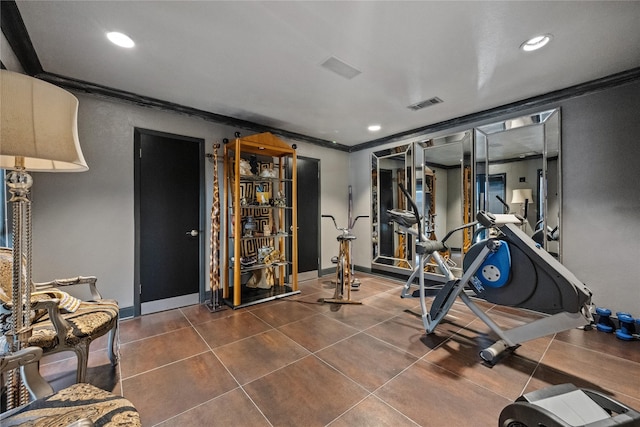 workout area with visible vents, dark tile patterned flooring, recessed lighting, crown molding, and baseboards