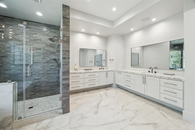 bathroom featuring recessed lighting, vanity, marble finish floor, and a shower stall