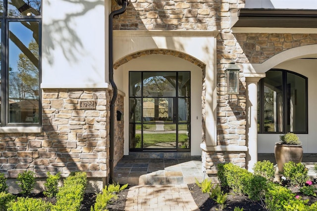 view of exterior entry with stone siding